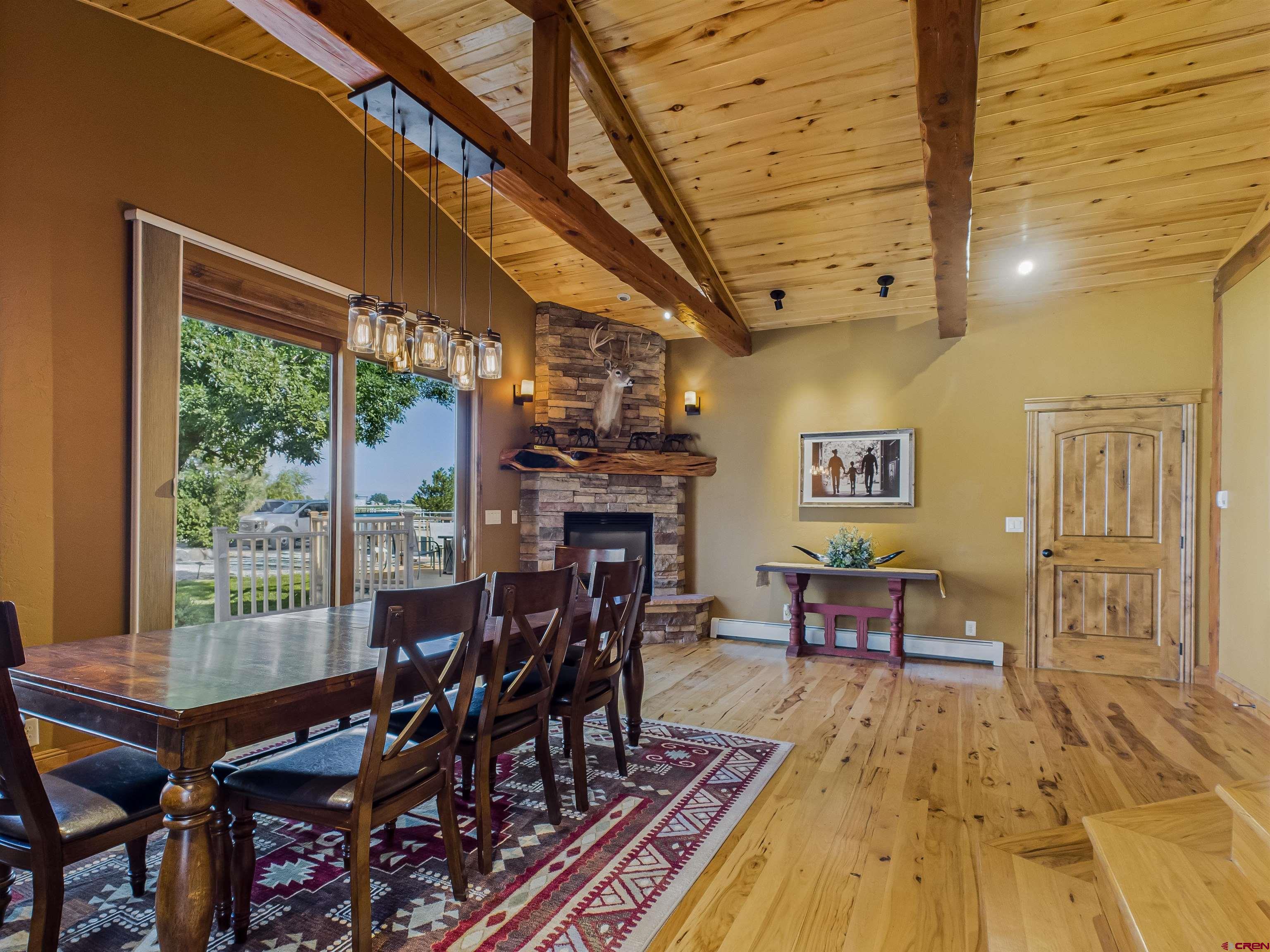 1577 14 1/2 Road Loma, CO 81524 - Photo 32 of 44 a view of a dining room with furniture window and wooden floor