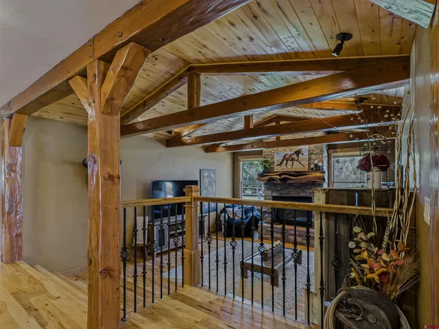 a room with pool table and windows