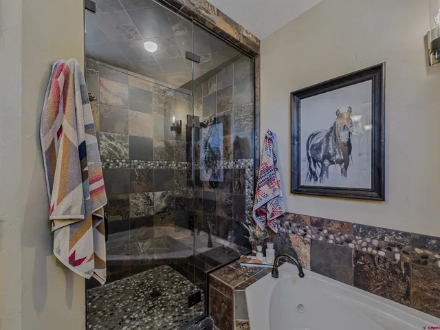 a bathroom with a sink double vanity and a mirror