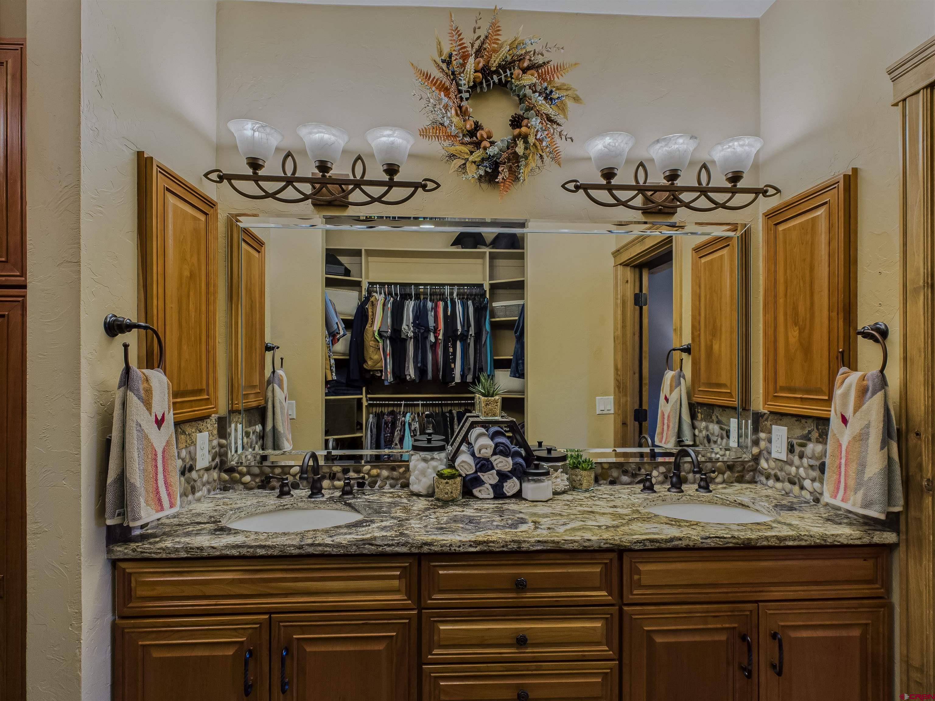 1577 14 1/2 Road Loma, CO 81524 - Photo 38 of 44 a bathroom with a sink double vanity and a mirror