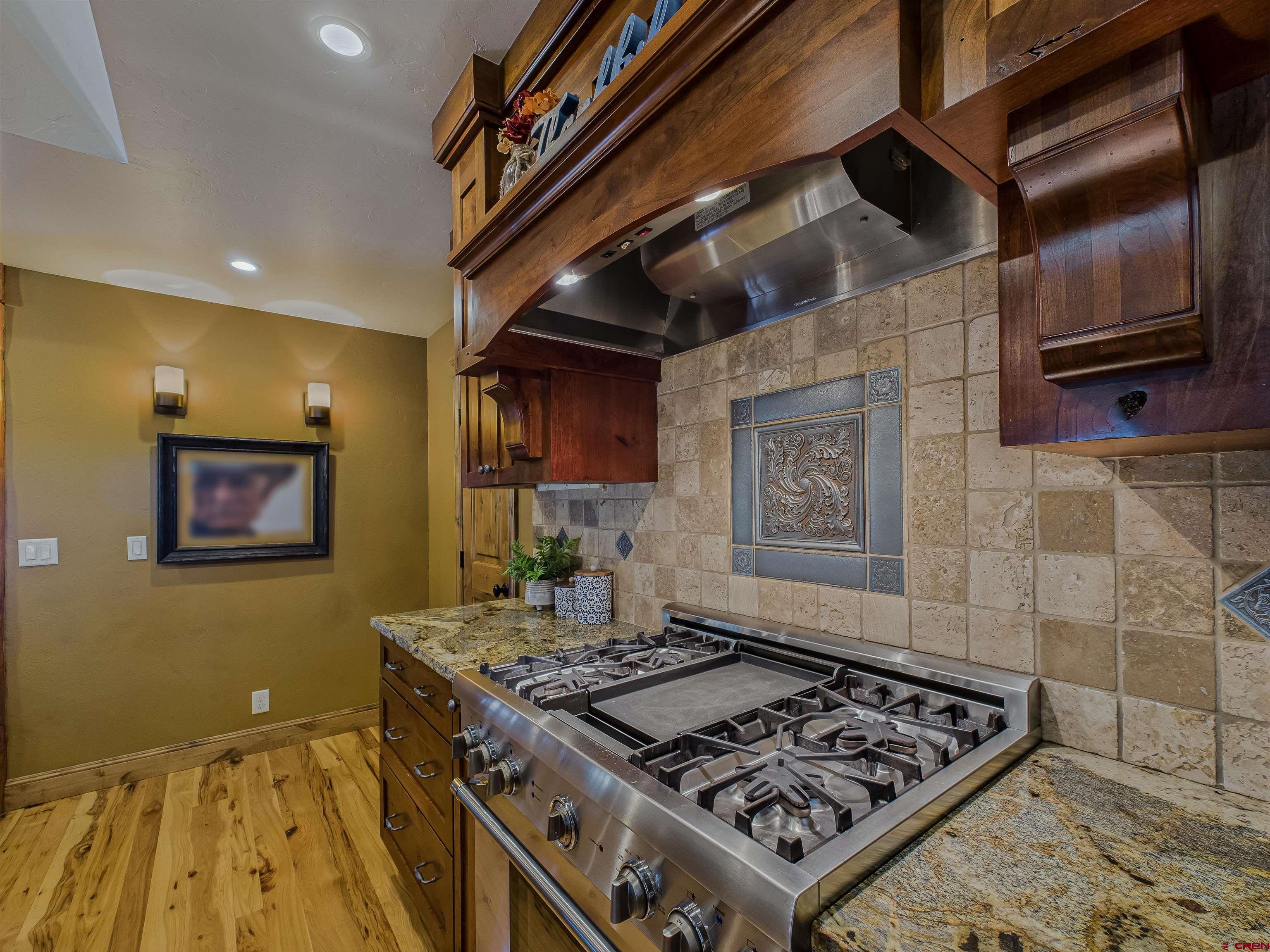 1577 14 1/2 Road Loma, CO 81524 - Photo 42 of 44 a stove top oven sitting inside of a kitchen