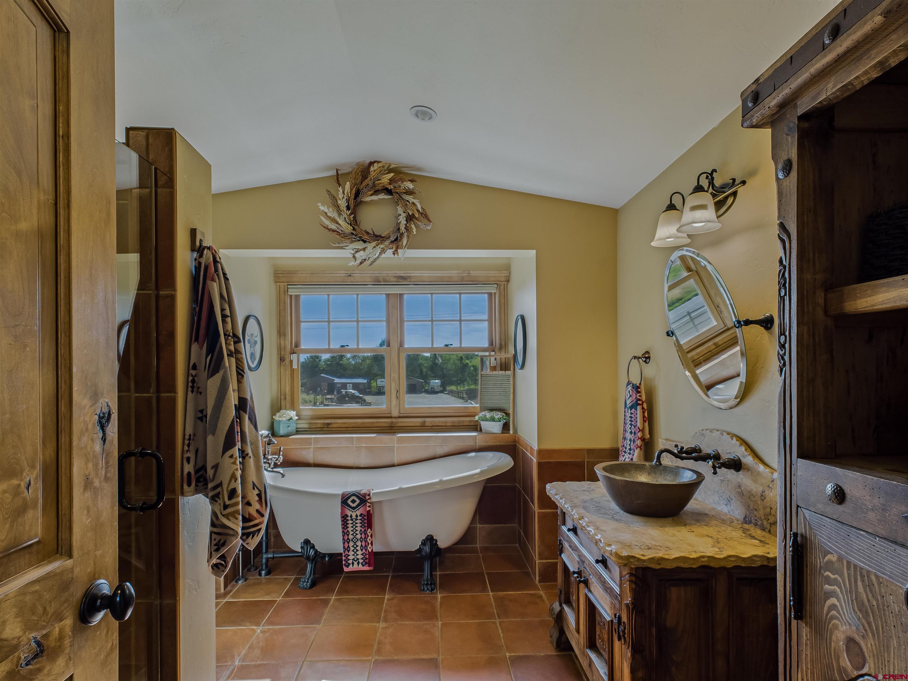 1577 14 1/2 Road Loma, CO 81524 - Photo 44 of 44 a bathroom with a toilet sink and mirror