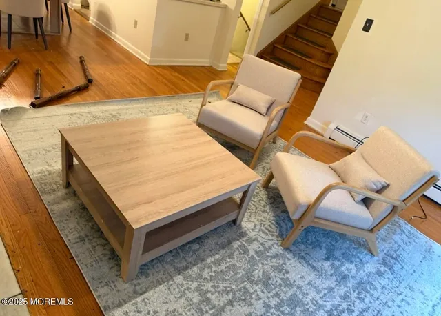 a kitchen with granite countertop wooden cabinets and stainless steel appliances