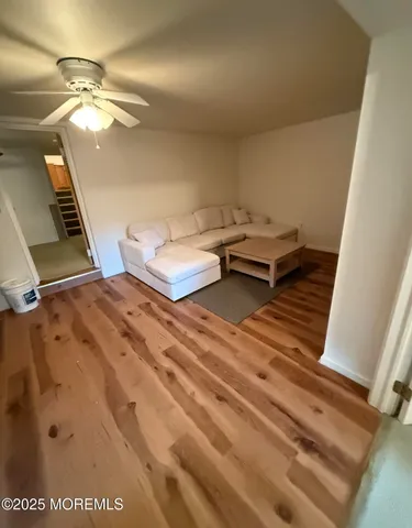 a bathroom with a tub a sink and a shower