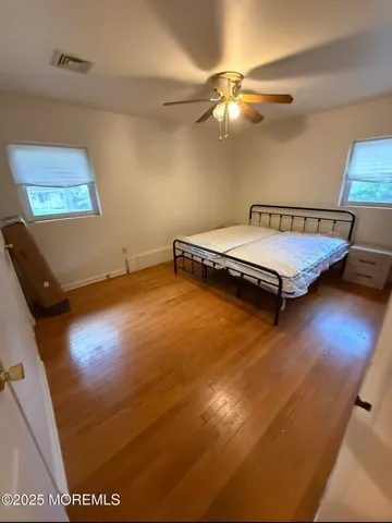 a bedroom with a bed and a table