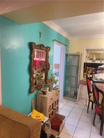 a bedroom with furniture and a fan