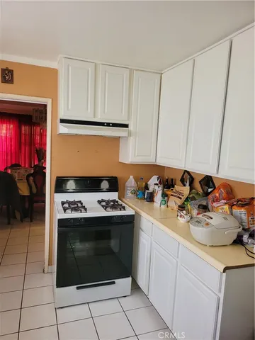 a kitchen with a stove and a sink