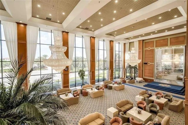 a room with furniture or couch and a large window