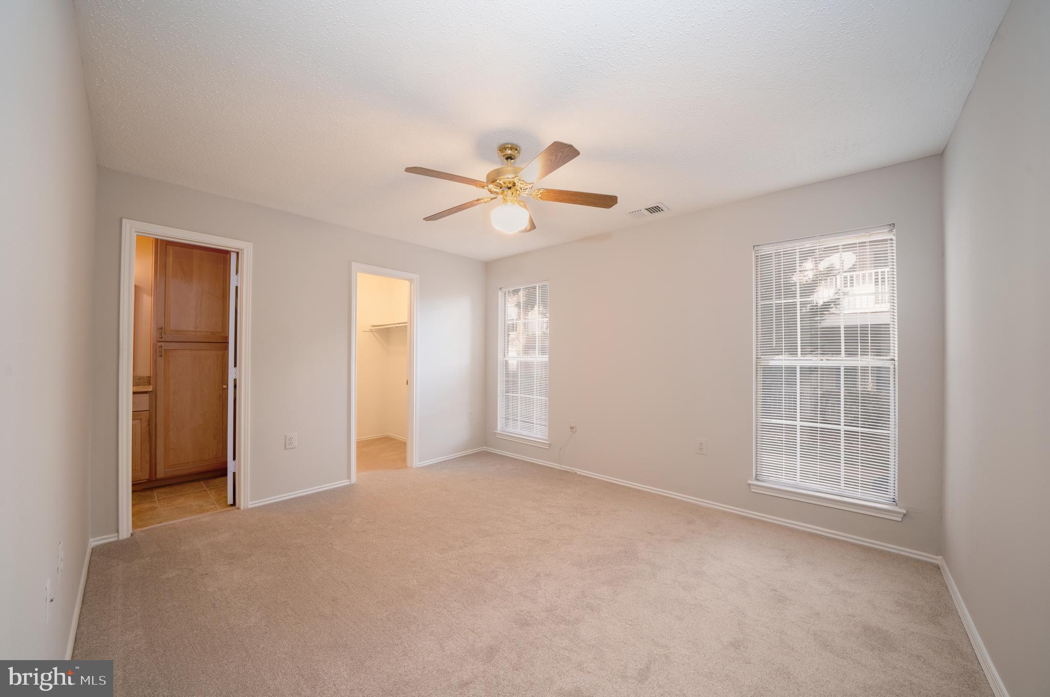 21007 Timber Ridge Terrace, Unit 104 Ashburn, VA 20147 - Photo 8 of 13 Primary Bedroom with en suite bathroom