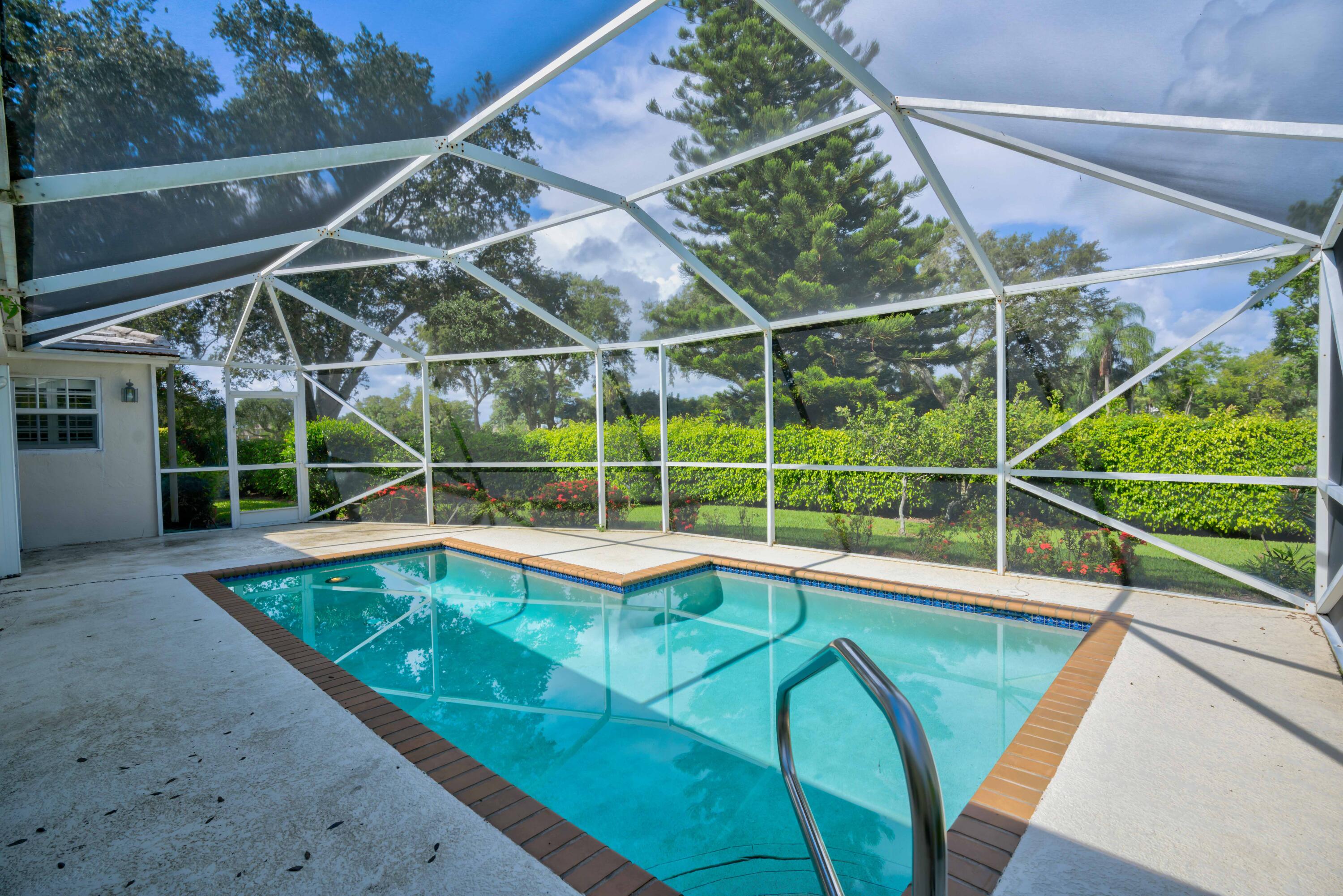 18253 Southeast Fairview Circle Jupiter, FL 33469 - Photo 1 of 54 a view of a backyard with swimming pool