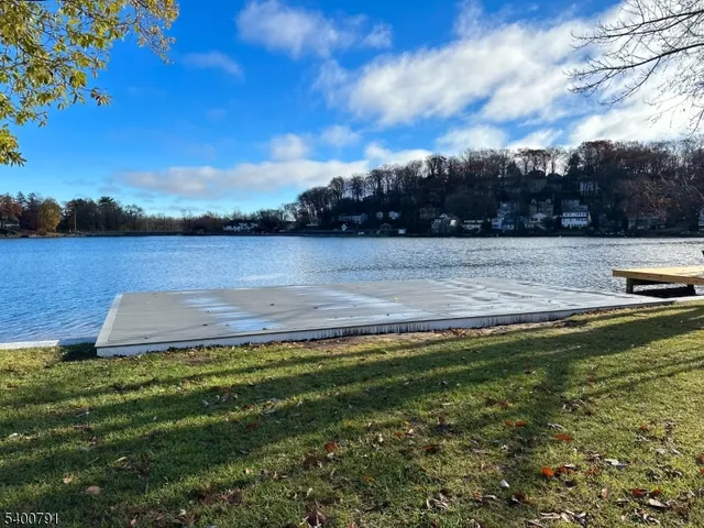 a view of a lake with houses in the back
