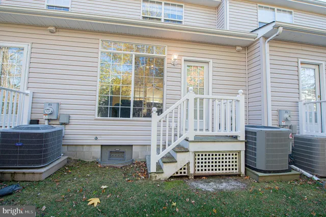 a dining room with furniture and chandelier