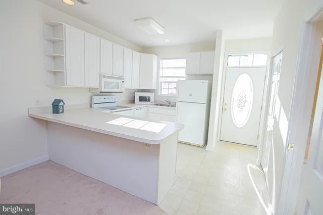 a living room with furniture and a stair