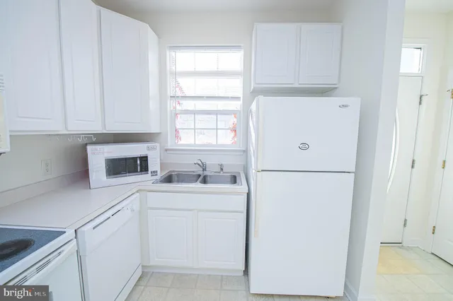 a dining room with a table chairs and a chandelier