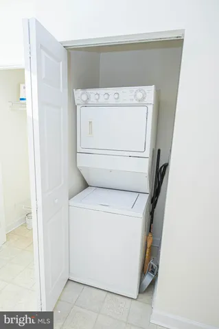 a living room with furniture and white walls