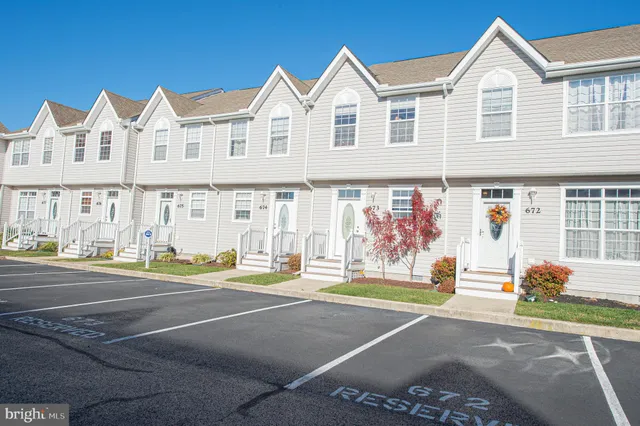 front view of a house with a large window