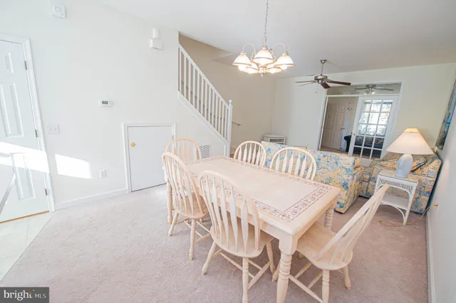 a view of a hallway with wooden floor and entryway