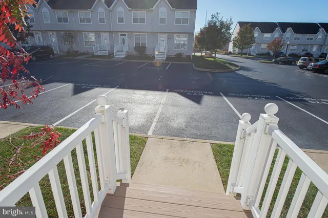 a kitchen with a refrigerator a stove a sink and cabinets