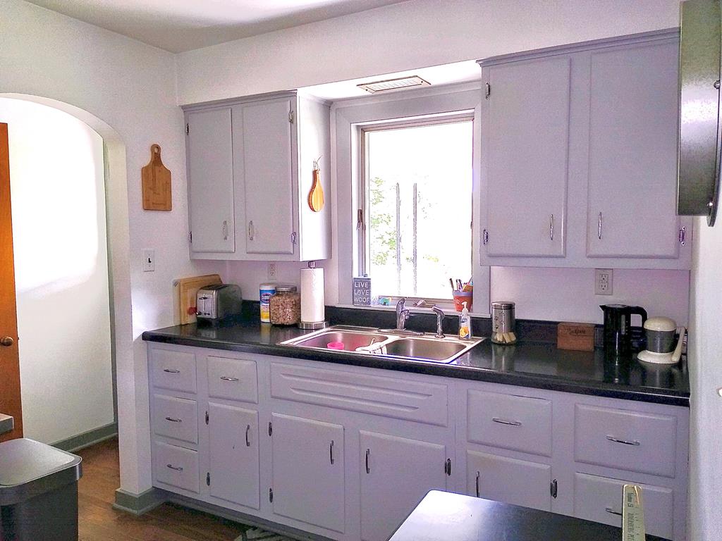 191 Baker Street Rimersburg, PA 16248 - Photo 8 of 13 a kitchen with granite countertop white cabinets sink and window