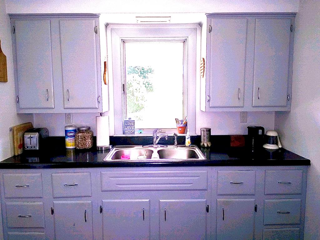 191 Baker Street Rimersburg, PA 16248 - Photo 10 of 13 a kitchen with white cabinets and a window