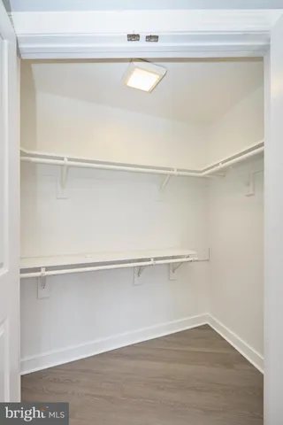 a view of an empty walk in closet