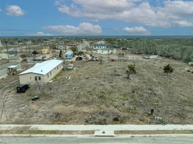a view of a terrace with yard and mountain view in back