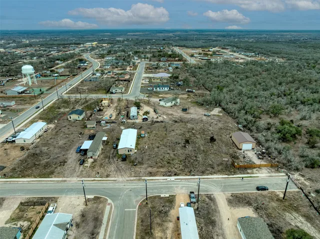 an aerial view of residential building and lake