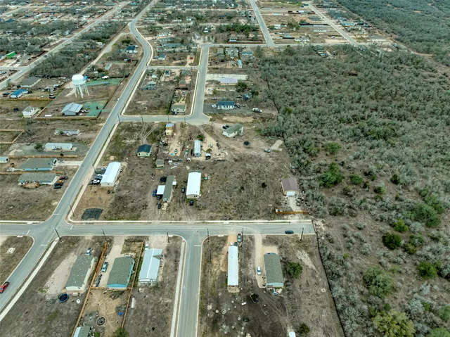 a bird view of a house with a yard