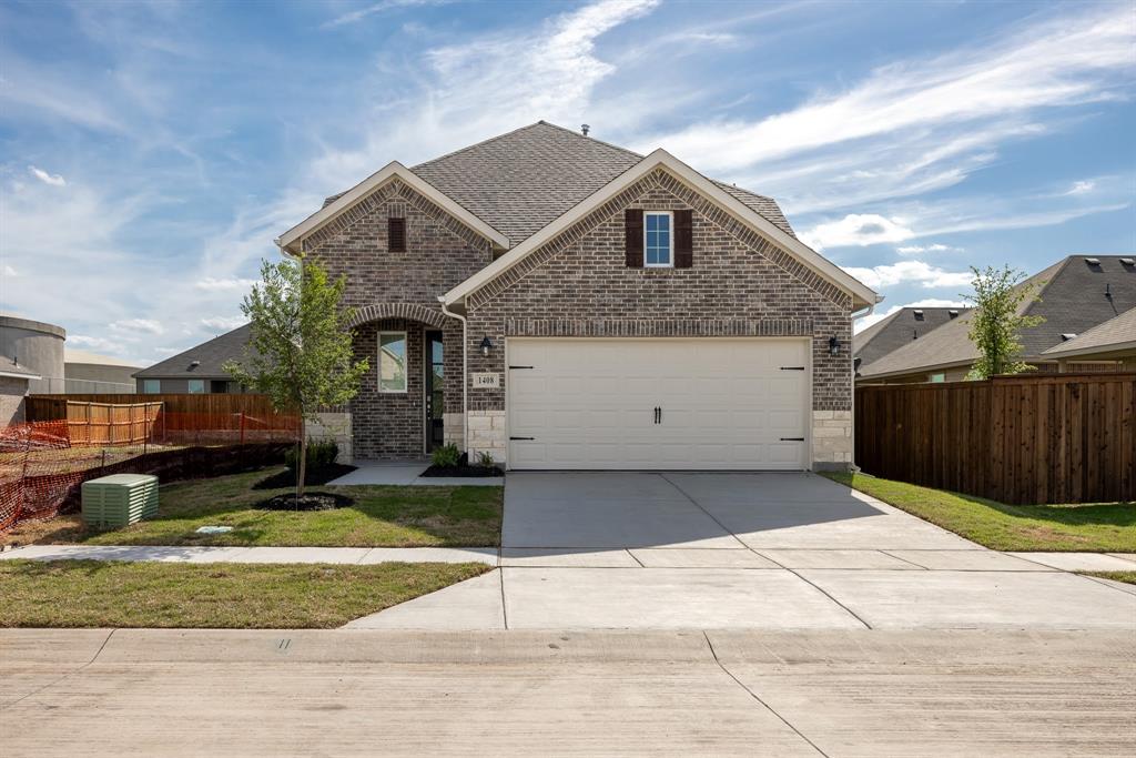 a front view of a house with a garage