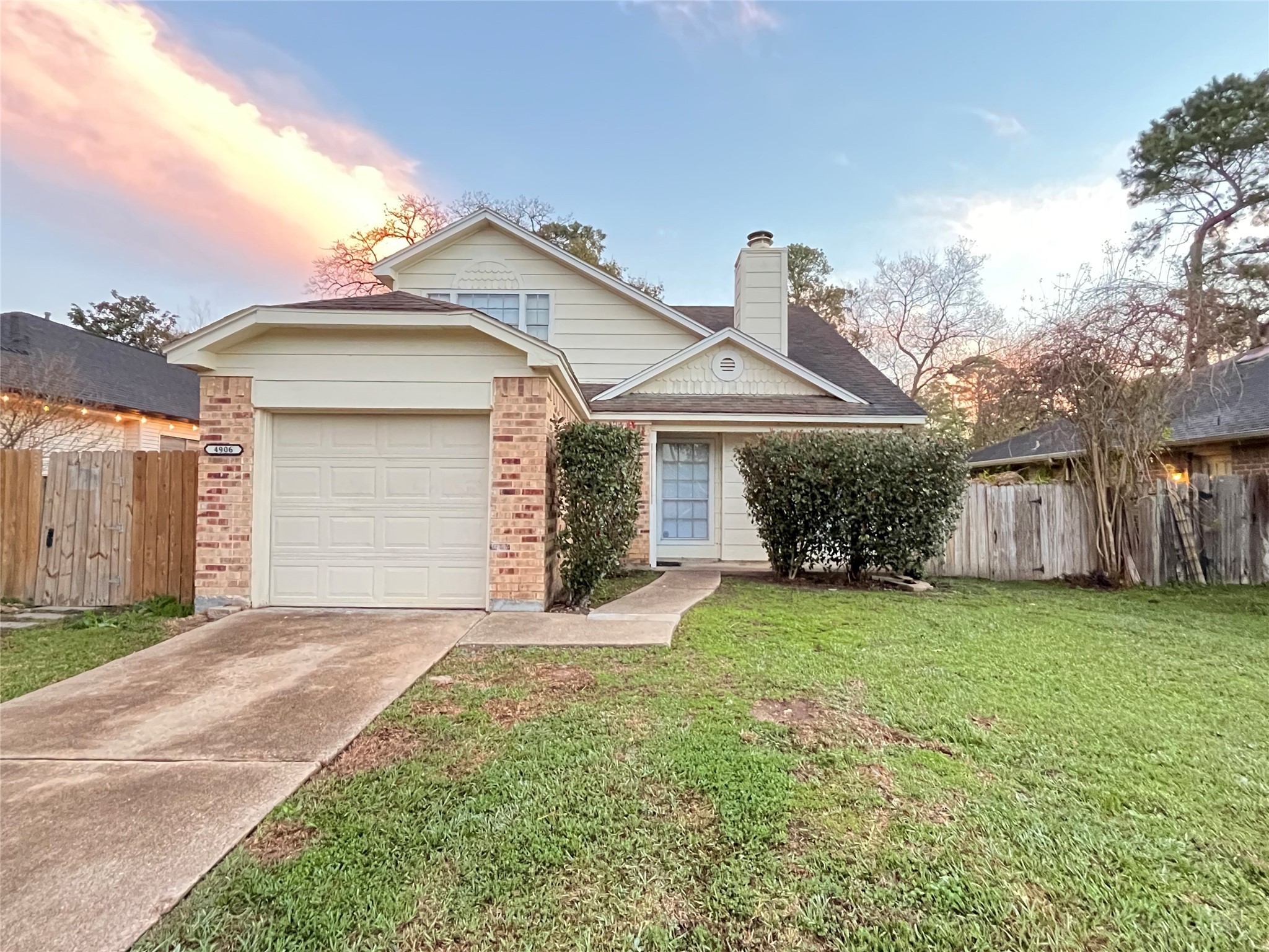 4906 Deer Point Drive Spring, TX 77389 - Photo 1 of 12 a front view of a house with a garden and yard