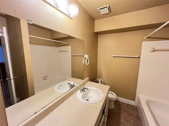 a bathroom with a sink and mirror