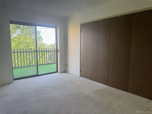 a view of a room with large windows