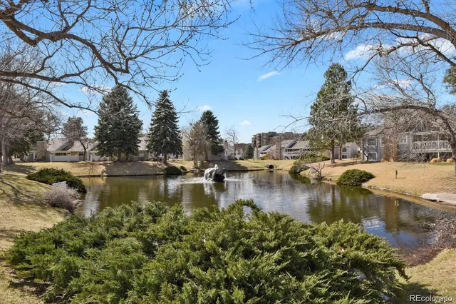 a front view of a house with a yard table and chairs