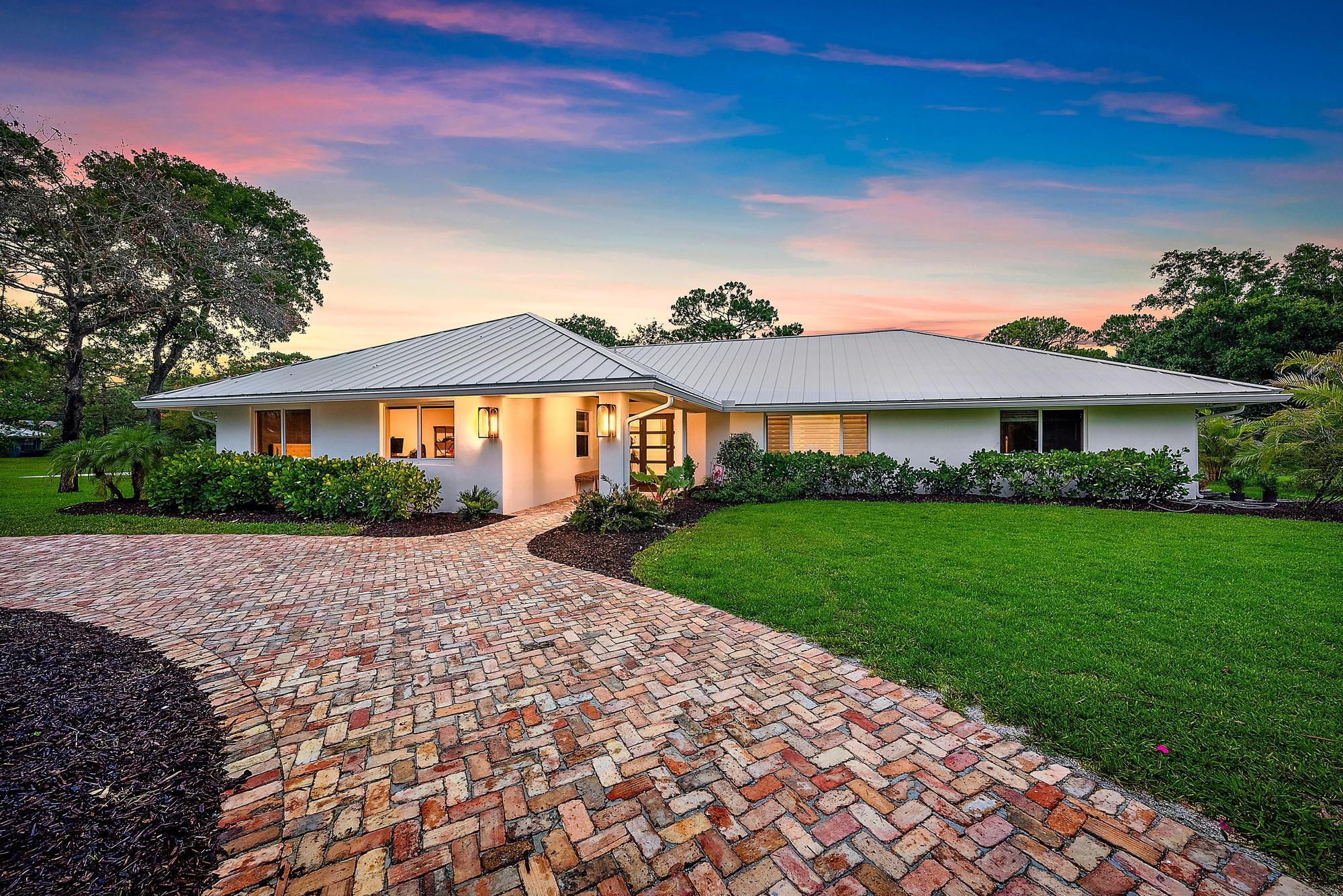 6799 Imperial Woods Road Jupiter, FL 33458 - Photo 1 of 51 Front Exterior
