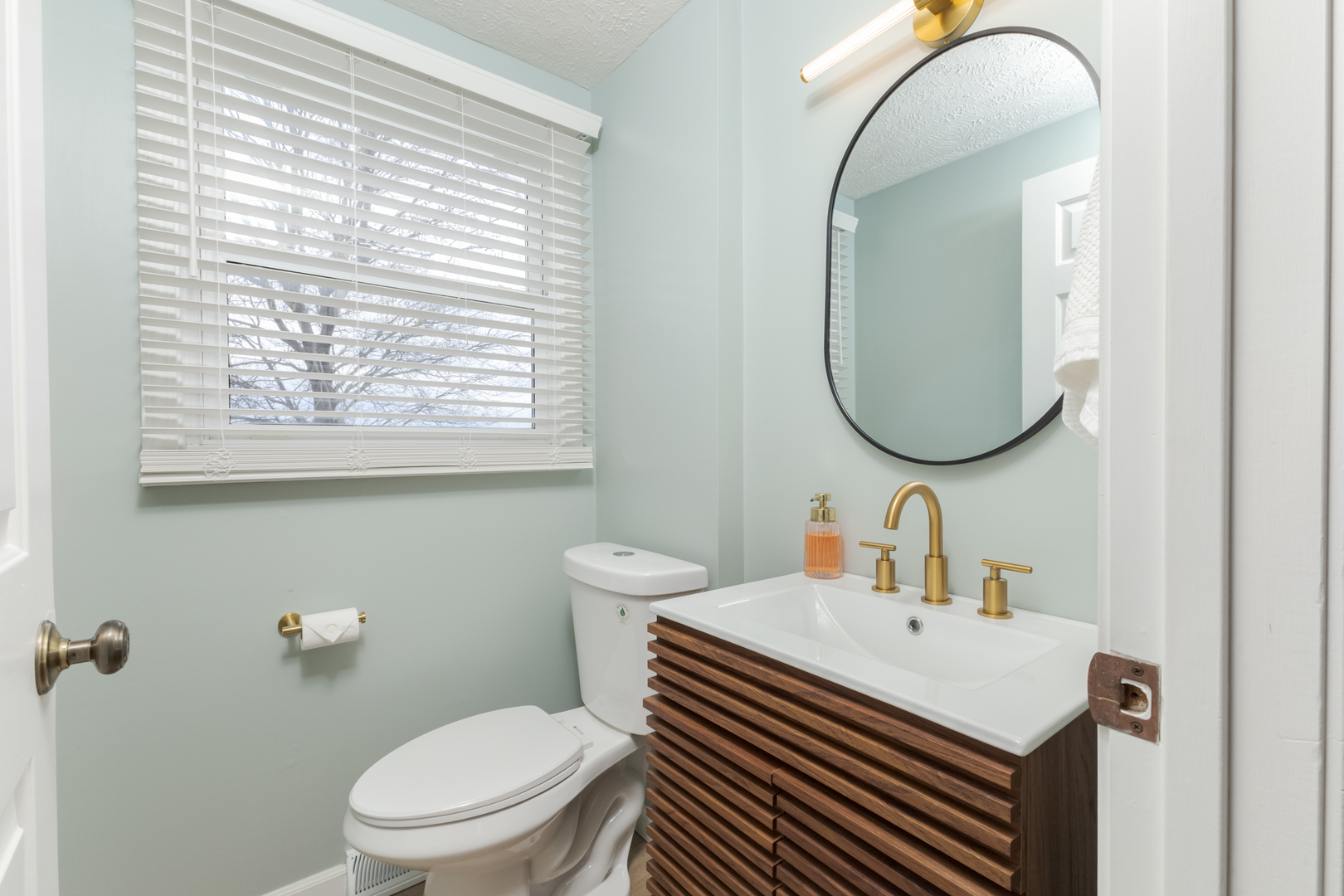 1805 Widermere Drive Normal, IL 61761 - Photo 16 of 46 a bathroom with a toilet a sink and a mirror