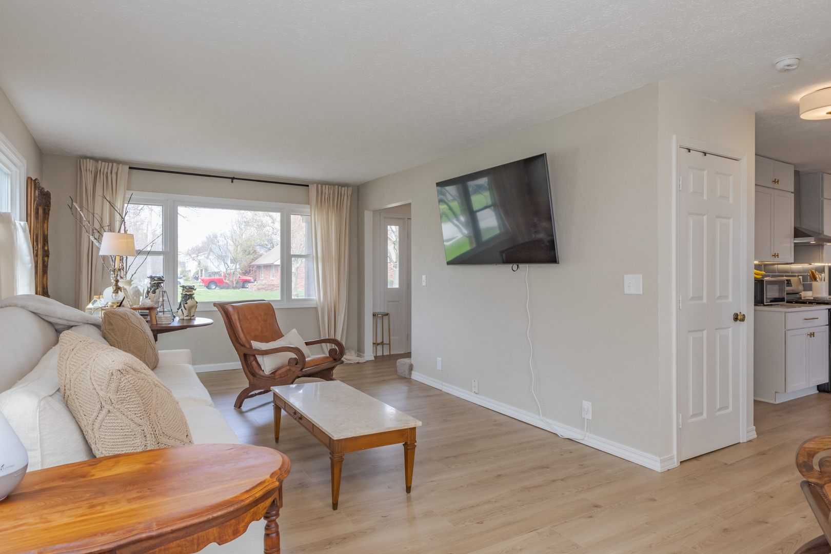 1805 Widermere Drive Normal, IL 61761 - Photo 17 of 46 a living room with furniture and a flat screen tv