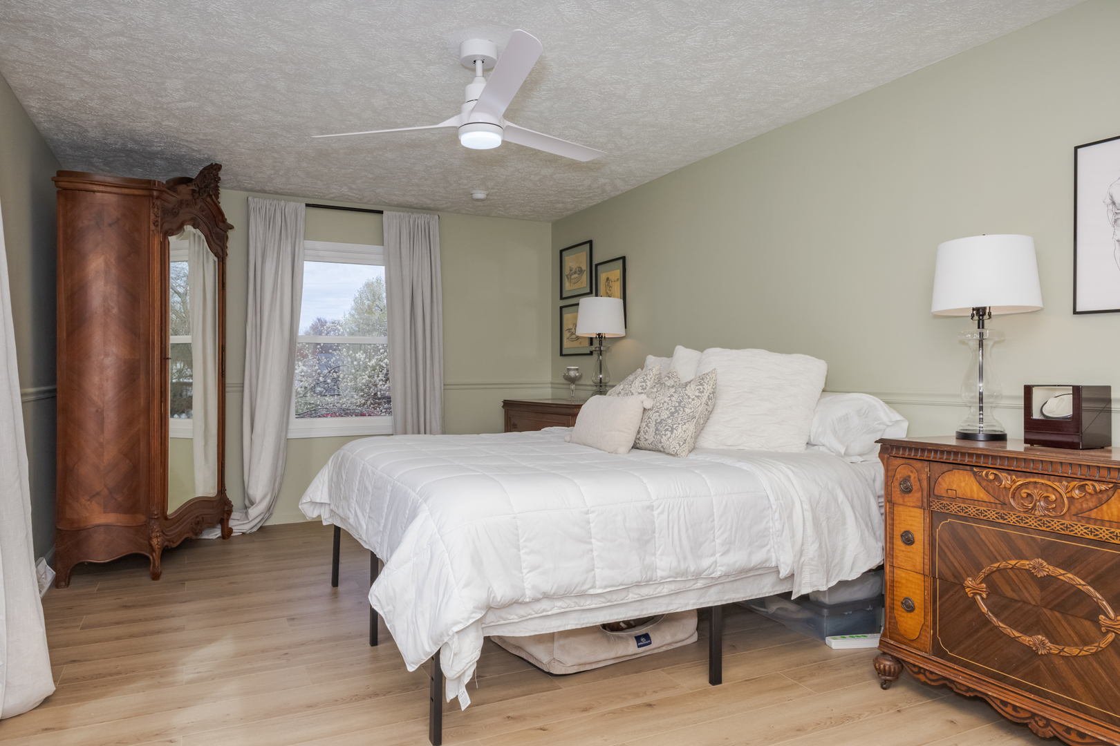 1805 Widermere Drive Normal, IL 61761 - Photo 22 of 46 a bedroom with a bed and a chandelier