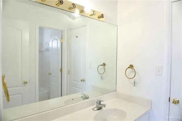 a bathroom with a bathtub and sink