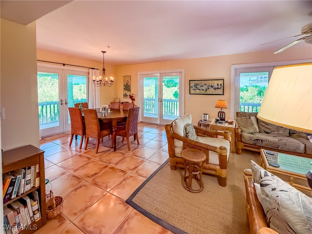 4511 Conch Shell Drive Upper Captiva, FL 33924 - Photo 12 of 50 a view of a dining room with furniture window and outside view