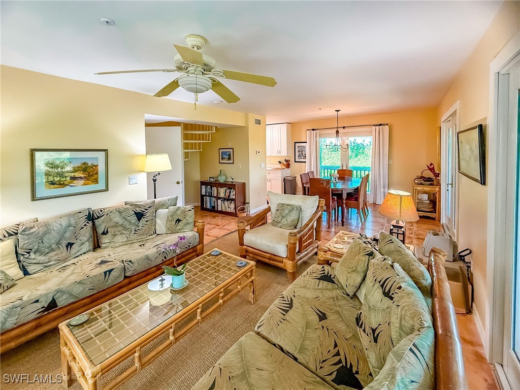 4511 Conch Shell Drive Upper Captiva, FL 33924 - Photo 13 of 50 a living room with furniture large window and flat screen tv