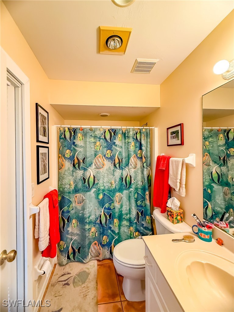 4511 Conch Shell Drive Upper Captiva, FL 33924 - Photo 18 of 50 a bed room with a bed and a couch