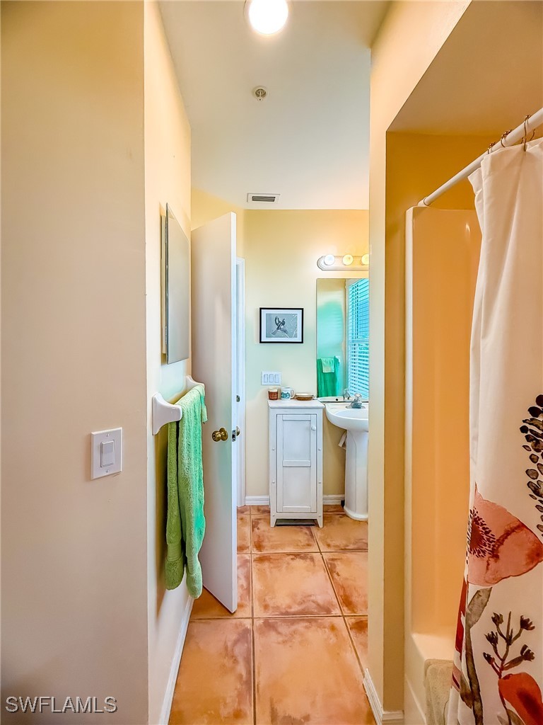 4511 Conch Shell Drive Upper Captiva, FL 33924 - Photo 20 of 50 a bathroom with a sink and a mirror