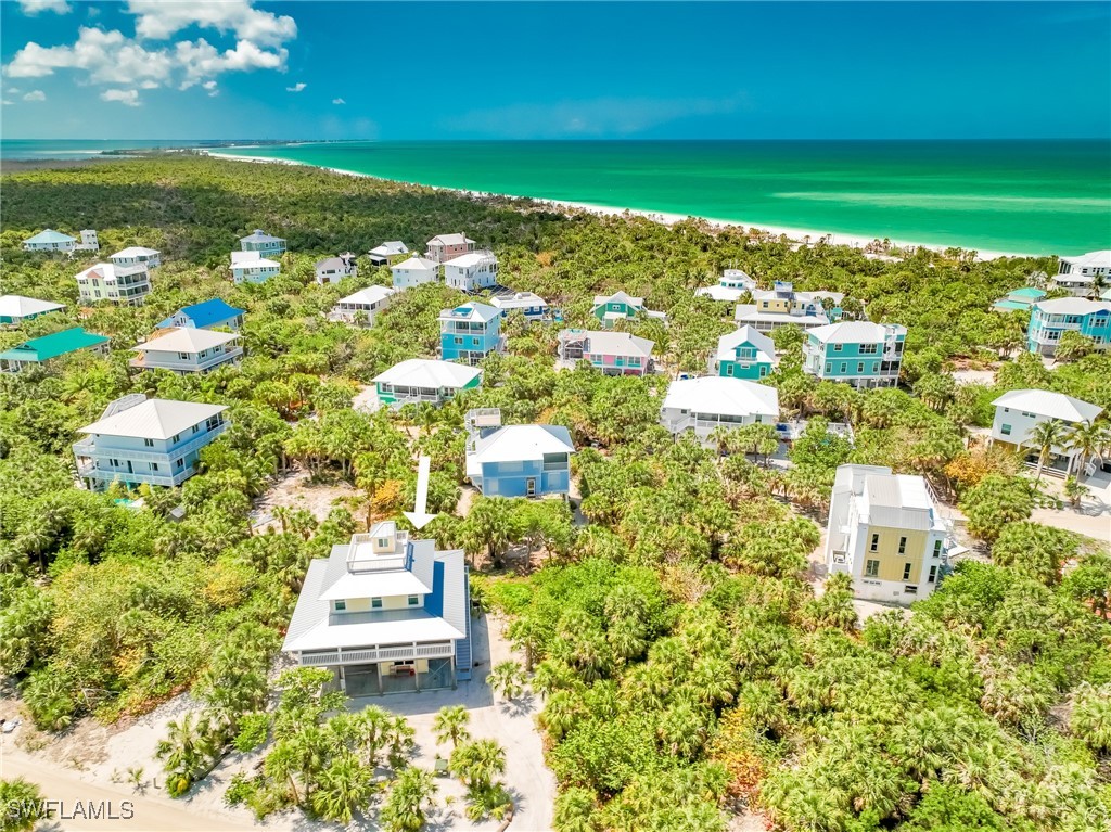 4511 Conch Shell Drive Upper Captiva, FL 33924 - Photo 2 of 50 a view of a city with an ocean