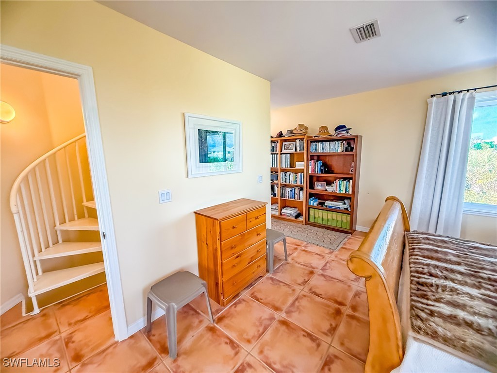4511 Conch Shell Drive Upper Captiva, FL 33924 - Photo 31 of 50 a view of a bedroom with furniture and rug