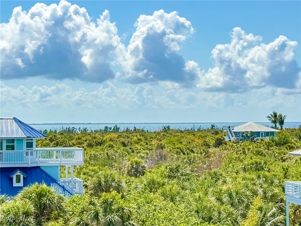 4511 Conch Shell Drive Upper Captiva, FL 33924 - Photo 40 of 50 a view of a yard with an outdoor seating