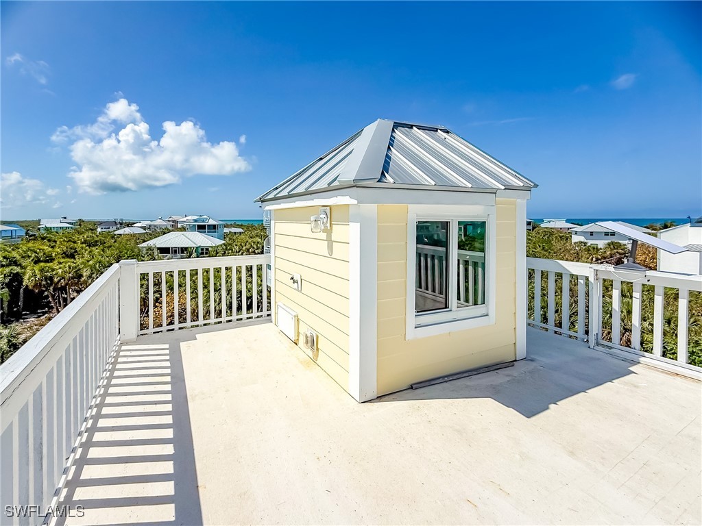 4511 Conch Shell Drive Upper Captiva, FL 33924 - Photo 41 of 50 a front view of a house with a balcony