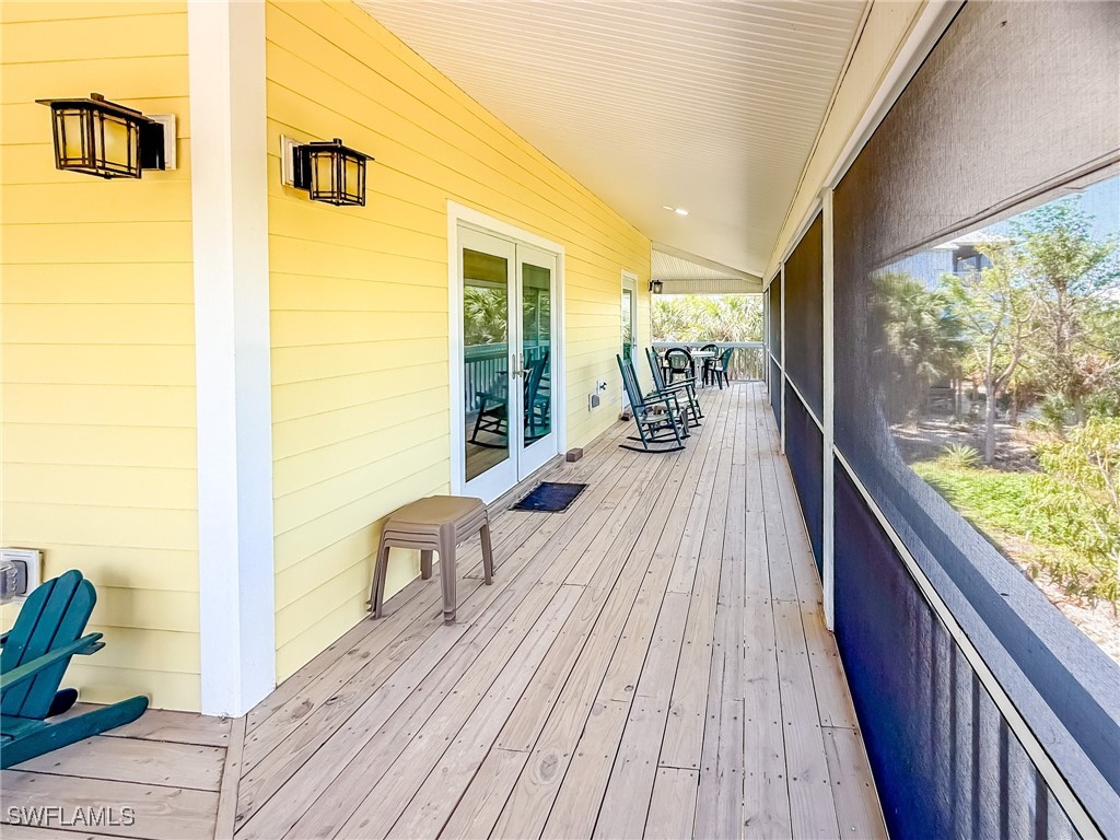 4511 Conch Shell Drive Upper Captiva, FL 33924 - Photo 43 of 50 a view of a balcony with wooden floor