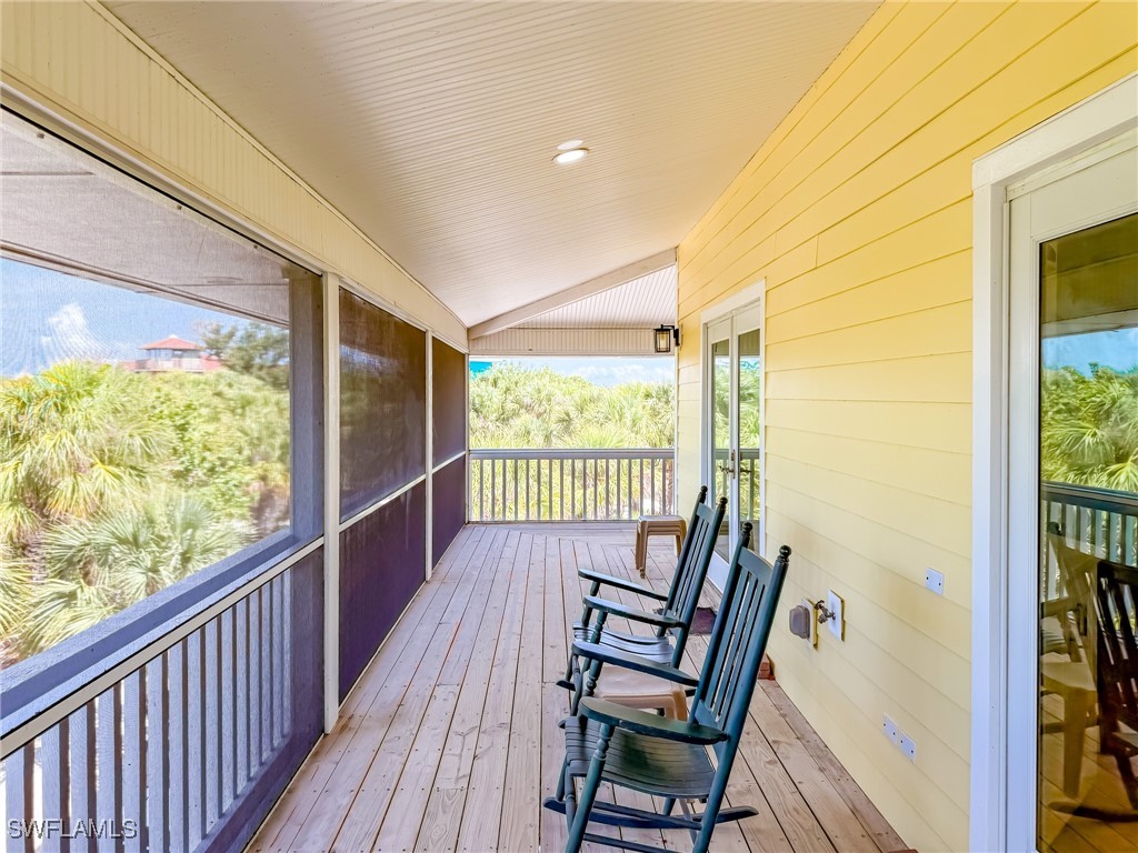 4511 Conch Shell Drive Upper Captiva, FL 33924 - Photo 46 of 50 a view of a balcony with wooden floor