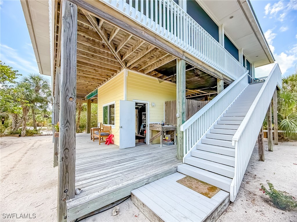 4511 Conch Shell Drive Upper Captiva, FL 33924 - Photo 48 of 50 a view of staircase with a rug and a window