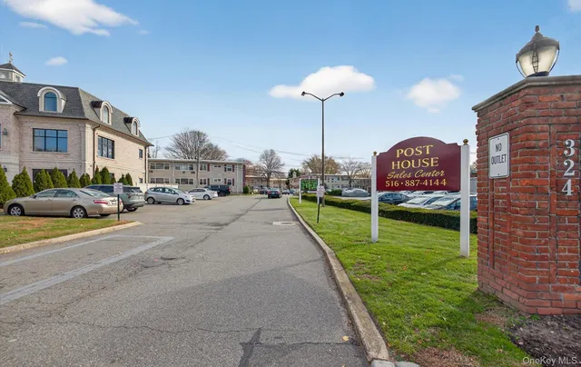 a view of a street with a building and a street sign